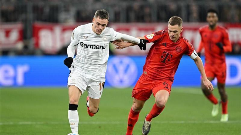 Umworbener Wirtz über Zukunft: Wird irgendwann davon lesen Am Samstag Gegner - irgendwann auch gemeinsam im Verein? Leverkusens Florian Wirtz (l) und Bayerns Joshua Kimmich.
