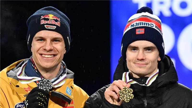 Eisenbichler feiert und sieht Weltrekord: „War mein Leben“ Andreas Wellinger (l) könnte nachträglich noch WM-Gold von Marius Lindvik (r) erhalten.