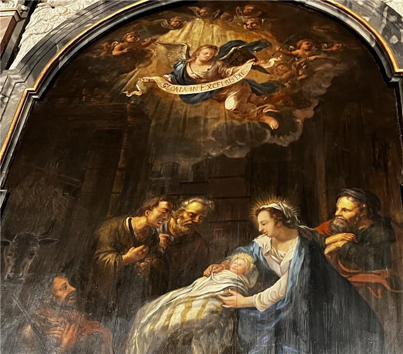 Besuch am Wochenbett: In diesem Krippenbild am Altar der St.-Petri-Kirche in Buxtehude stehen die drei Weisen aus dem Morgenland betend vor Jesus, Maria und Josef.