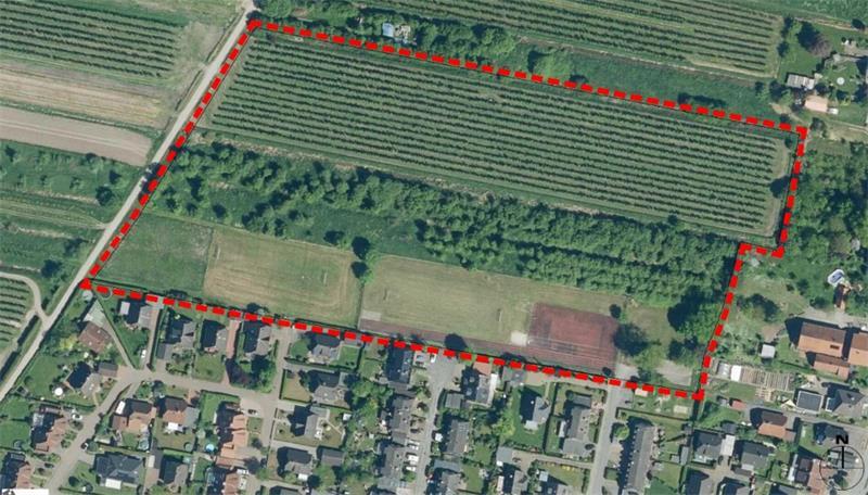 Neues Wohngebiet in Guderhandviertel: Platz für rund 80 neue Wohneinheiten Blick von oben auf das alte Wohngebiet an der Blütenstraße und die rot umrandete Erweiterungsfläche im Norden.