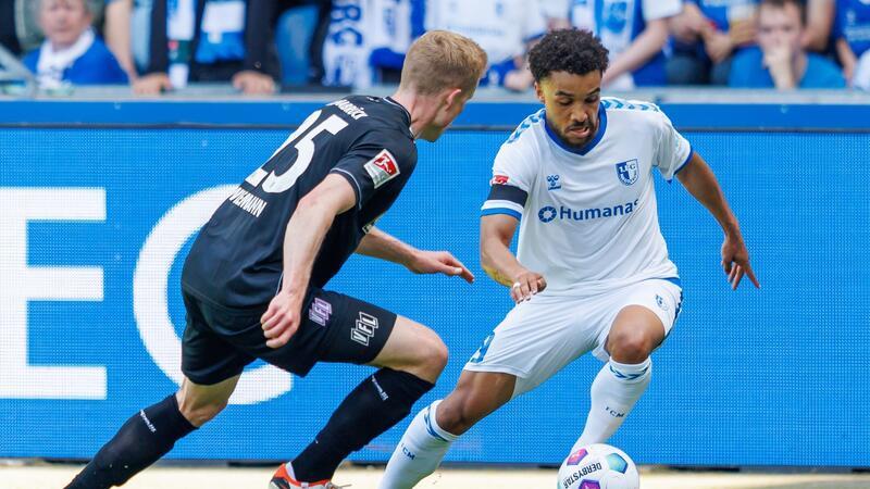 Abstieg rückt näher: Osnabrück nur 1:1 in Magdeburg Der Magdeburger Leon Bell Bell (r) im Dribbling gegen Osnabrücks Niklas Wiemann.