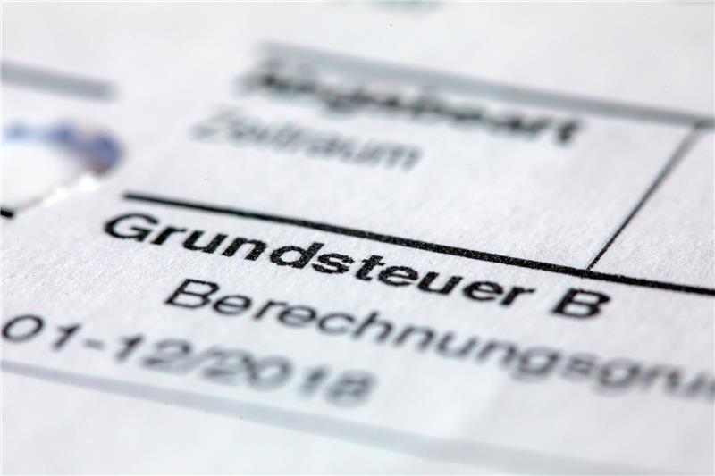 Die Grundsteuererklärung ist für Laien nicht einfach. Stiftung Warentest hat Programme getestet, die die Grundsteuererklärung erleichtern sollen. Foto: Jens Büttner/dpa-zentralbild/dpa