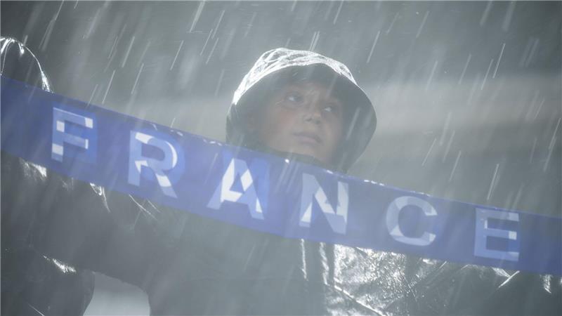 Ein französischer Fan im Regen von Philadelphia.