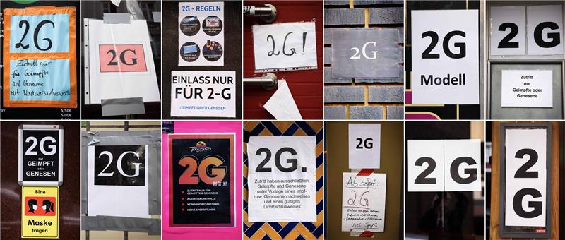 In Hamburg nutzen bereits 1150 Betriebe das 2G-Modell Eine Kombo zeigt verschiedenen Hinweise zum Einlass nach den 2G-Regeln (Geimpft, Genesen) an Bars, Clubs und Kneipen auf der Reeperbahn, der Großen Freiheit und auf dem Hans-Albers-Platz. Foto: Christian Charisius/dpa