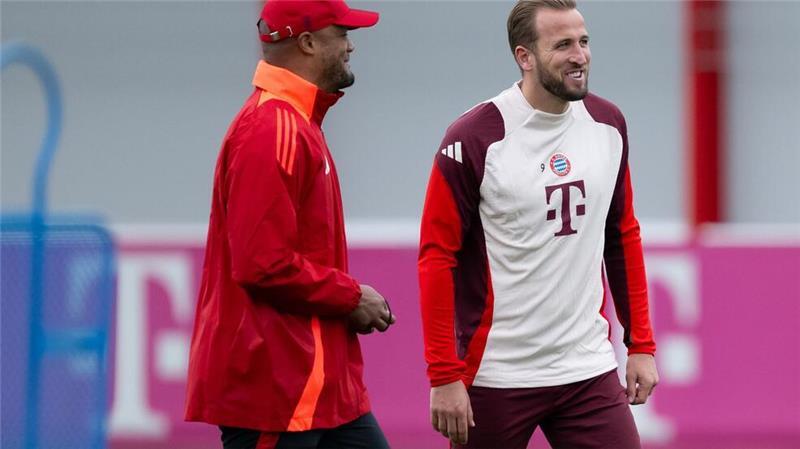 Gut gelaunt beim Training: Trainer Vincent Kompany (l) und Torjäger Harry Kane.