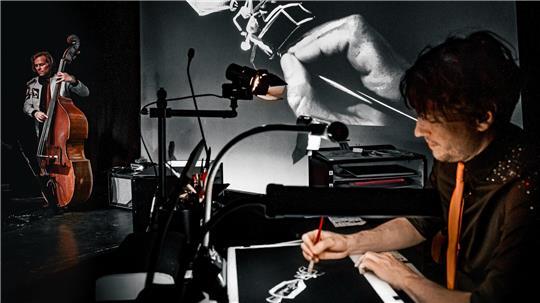 In seiner Show „Paper Moon“ bringt Robert Nippoldt live auf der Bühne Zeichnungen rund um das Thema Raumfahrt zu Papier.