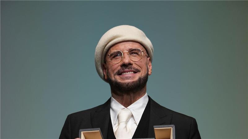 Mit dieser Überraschung hatte John Travolta nicht gerechnet: Eine Ehrenpalme für sein Lebenswerk.