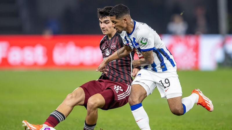 Nürnbergs Can Uzun (l) zeigte beim 3:3 in Berlin eine starke Leistung.