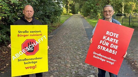 Ralf Kimmel (CDU) und Heuweg-Anwohner Paul Müller (FDP) kämpften gemeinsam für die Abschaffung der Straßenausbaubeitragssatzung (von links).