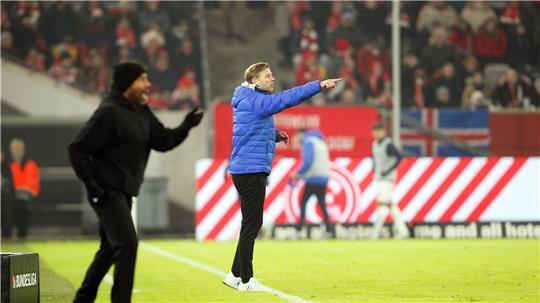 Schon einmal Gegner in der zweiten Liga: Der neue Werder-Trainer Daniel Thioune und der frühere Werder-Trainer Florian Kohfeldt (r). 