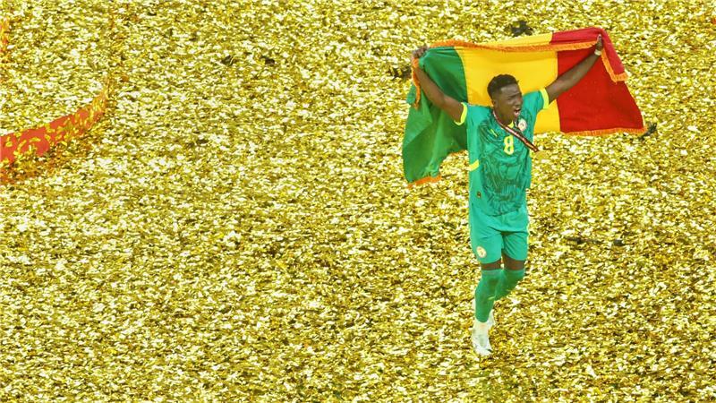 Senegals Lamine Camara jubelt nach dem Sieg gegen Marokko im Afrika Cup.