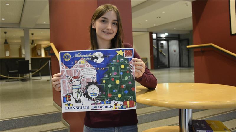 Preisverleihung für den neuen Adventskalender in der HPS Siegerin Lilly Sophie mit ihrem Bild.