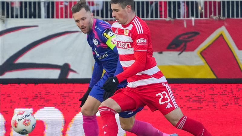 Emotionale Fischer-Rückkehr: Mainz verpasst Sieg bei Union Silvan Widmer (l.) und Andrej Ilic (r.) kämpfen um den Ball.