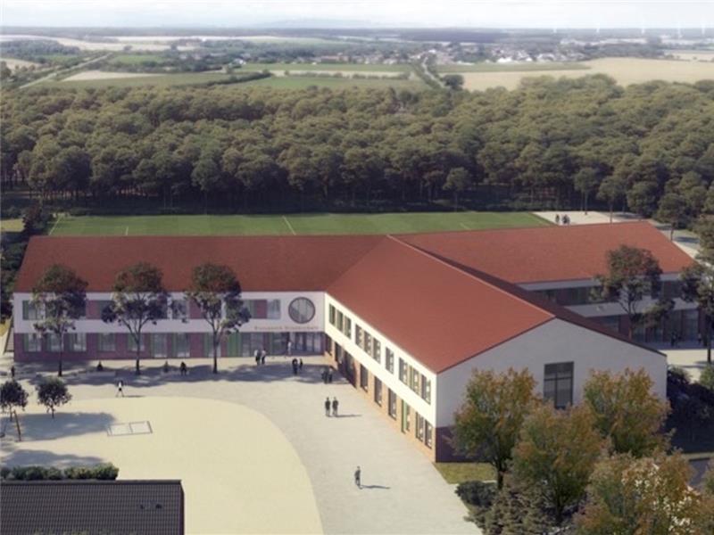 So soll die neue Rosenborn-Grundschule in Harsefeld aussehen. Im Hintergrund ist der Sportplatz zu sehen, über den die Baustraße während der Arbeiten führen wird. Der Neubau entsteht gegenüber der jetzigen Schule auf dem hinteren Bereich de