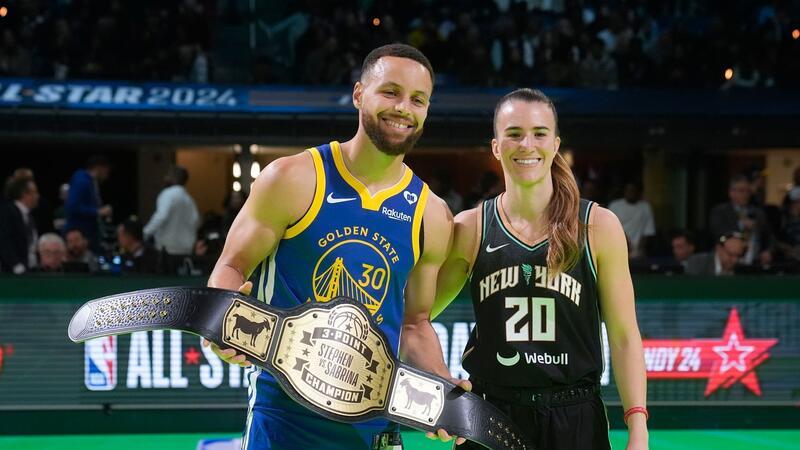 Stephen Curry bezwingt Sabrina Ionescu im Dreierwettbewerb Stephen Curry von Golden State Warriors und Sabrina Ionescu von den New York Liberty posieren für Fotos.