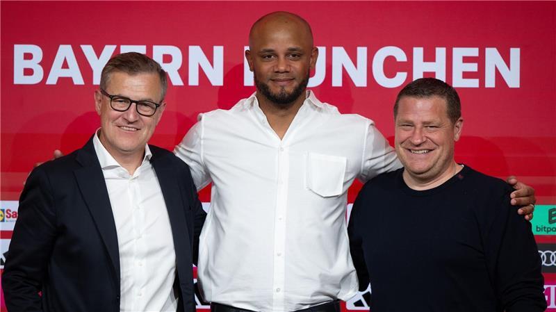 „Der Boss bleibt“: Neuer Kompany-Vertrag vor Belgien-Duell Weiter ein Team: Vorstandschef Jan-Christian Dreesen (l), Trainer Vincent Kompany (M) und Sportvorstand Max Eberl. (Archivbild)