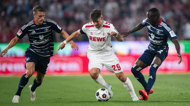HSV-Trainer überrascht mit Taktikwechsel und Kommentar zu Königsdörffer Zum Start in die Zweitliga-Saison lieferten sich der 1. FC Köln um Jan Thielmann und der Hamburger SV um Miro Muheim (l) und Jean-Luc Dompe (r) eine temporeiche Partie.